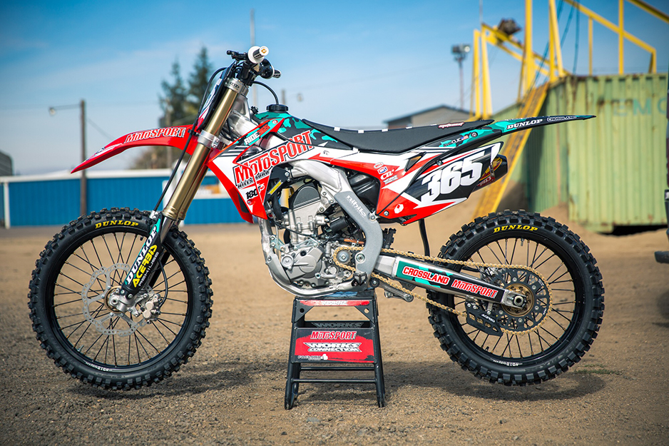 Motocross bike with red and white graphics