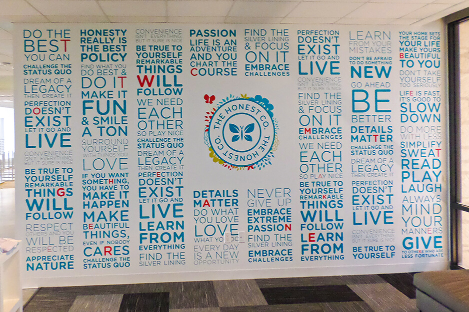 Light blue typographic wall graphics for Honest Company printed on a Roland DG wide-format printer/cutter
